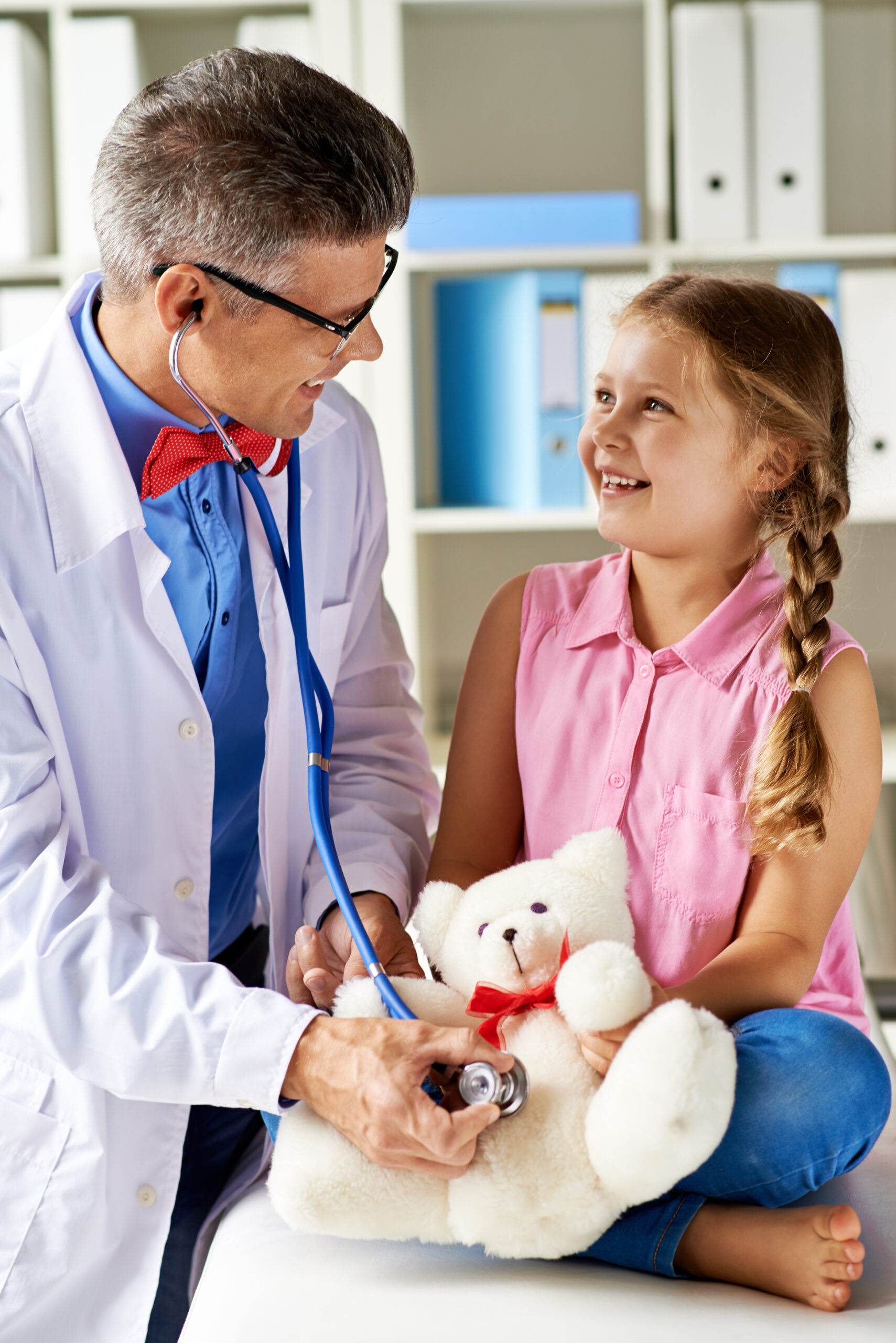 doctor-checking-little-girl-with-stethoscope-scaled